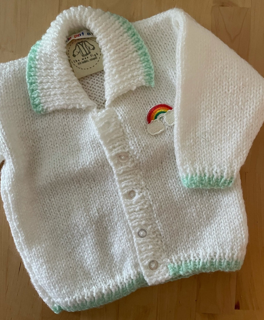 0-3 months - White rainbow cardigan with green trim